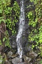 Waterfall running onto rocks in the daytime