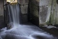 Waterfall in a small opening of a river lock