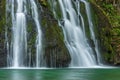 Waterfall from the source of the Lison in a haven of peace with its waterfall surrounded by forest