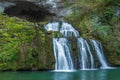 Waterfall from the source of the Lison in a haven of peace with its waterfall surrounded by forest