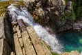 Waterfall on steps or terraces in green landscape between trees and mountains in Ordesa. Soaso stands. Spain