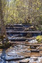 Waterfall in a stream in a budding forest at springtime Royalty Free Stock Photo