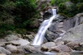 Waterfall on stream with rocks and veil effect Royalty Free Stock Photo