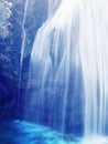 Waterfall strings blule azure colored water drops nature sceene