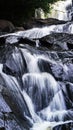 A waterfall with a super gentle river flow and crystal-like rocks