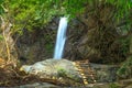 Waterfall surounded with green forest Royalty Free Stock Photo