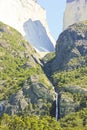 Waterfall in torres del paine above rock walls Cuernos, patagonia Royalty Free Stock Photo