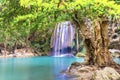 Waterfall in tropical forest with green tree and emerald lake, Erawan, Thailand Royalty Free Stock Photo