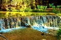 Waterfall in tropical green tree forest. Waterfall is flowing in jungle Royalty Free Stock Photo