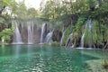 Waterfall into Turquoise Green Lake