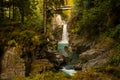 A waterfall under a bridge Royalty Free Stock Photo