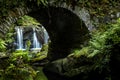 A waterfall under the bridge Royalty Free Stock Photo