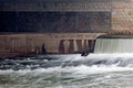 Waterfall under a city bridge Royalty Free Stock Photo