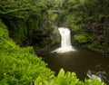 Waterfall under road bridge at Seven Sacred Pools Maui Royalty Free Stock Photo
