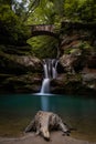 Waterfall under a stone bridge in Hocking Hills, Ohio Royalty Free Stock Photo