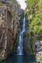 Waterfall of Veu da Noiva between the covered stones of moss and the vegetation