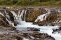 Waterfall in wild landscape in the evening light