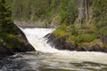 Waterfall on the wild river in northern Finland. Royalty Free Stock Photo