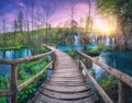 Waterfall and wooden path in green forest. Plitvice Lakes Croatia Royalty Free Stock Photo