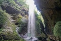 Waterfalls in the canyon fall from the sky. Like a silver-white chain.