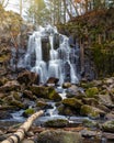 Waterfalls cascade in autumn season colors in the forest Royalty Free Stock Photo