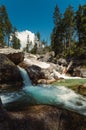 Waterfalls of cold creek in High Tatras National park. Mountain river  with crystal clear water in beautiful sunny day Royalty Free Stock Photo