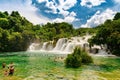 Waterfalls of Croatia.Tourists swimming near waterfalls in crystal clear water. Tourist spot in Dalmatia Krka National Park, place