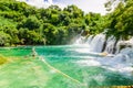 Waterfalls of Croatia.Tourists swimming near waterfalls in crystal clear water. Tourist spot in Dalmatia Krka National Park, place