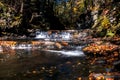 Waterfalls flow gently over rocks in the gorge Royalty Free Stock Photo