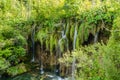 Waterfalls in Plitvice Lakes National Park, Croatia. Waters Flow over Steep Rocks through the Trees. Heaven On Earth Royalty Free Stock Photo