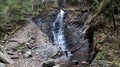 Waterfalls in a small canyon with stone walls. Beautiful cascade in the mountains. river in the Carpathians in the mountain autumn Royalty Free Stock Photo