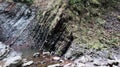 Waterfalls in a small canyon with stone walls. Beautiful cascade in the mountains. river in the Carpathians in the mountain autumn Royalty Free Stock Photo