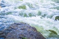 Waterflow. Water flowing over the rock. Mountain river Royalty Free Stock Photo