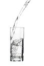 Waterflowing into a glass isolated on white Royalty Free Stock Photo