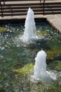 Two water fountains in a man made pond