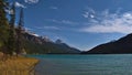 Waterfowl Lake in Banff National Park, Canada with turquoise shimmering water, yellow grass and snow-capped Rocky Mountains. Royalty Free Stock Photo