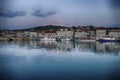 Waterfront and anchored boats in harbor