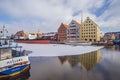Waterfront of beautiful Old Town in Gdansk with old ships in ice. Royalty Free Stock Photo