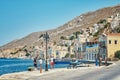 Waterfront with boats moored on sea berth against buildings