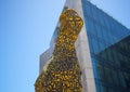 Large creative yellow sculpture standing in the Silo District in Cape Town.