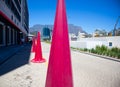 Tall and pink construction cones standing in the Silo District in Cape Town.