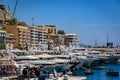 Waterfront cityscape, luxury buildings and yachts in Monte Carlo marina, Monaco