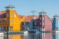 Waterfront with colorful wooden houses in Dutch Reitdiep harbor, Groningen Royalty Free Stock Photo