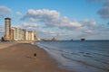 Waterfront, dunes and view on Vlissingen city with sandy beach on sunset