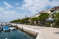 Waterfront and harbor and boats in summer by the sea in Izola, Slovenia. Royalty Free Stock Photo