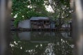 Waterfront old house at river in the old town of the city of Bangkok, at Thailand