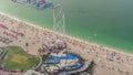 Waterfront overview Jumeirah Beach Residence JBR skyline aerial timelapse with yacht and boats