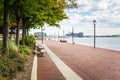 Waterfront Path under a Cloudy Sky with Patches of Blue