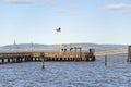 Waterfront pier at Tacoma in Washington with a USA flag Royalty Free Stock Photo