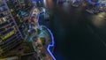 Waterfront Promenade With Palms In Dubai Marina Aerial Night Timelapse.